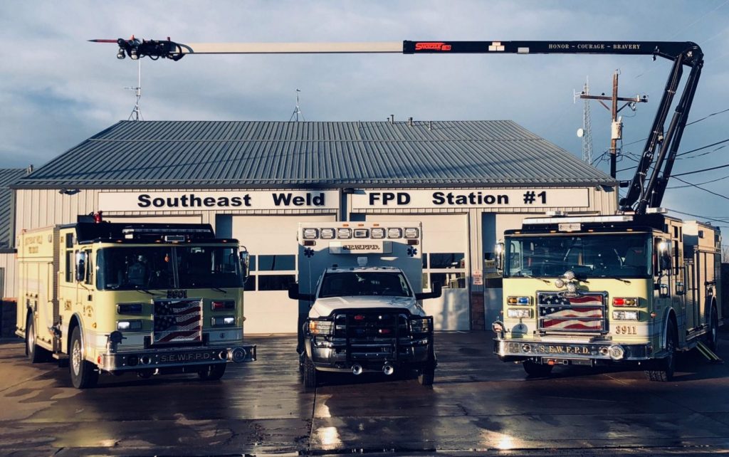 Two fire trucks and an ambulance in front of our Southeast Weld FPD Station #1